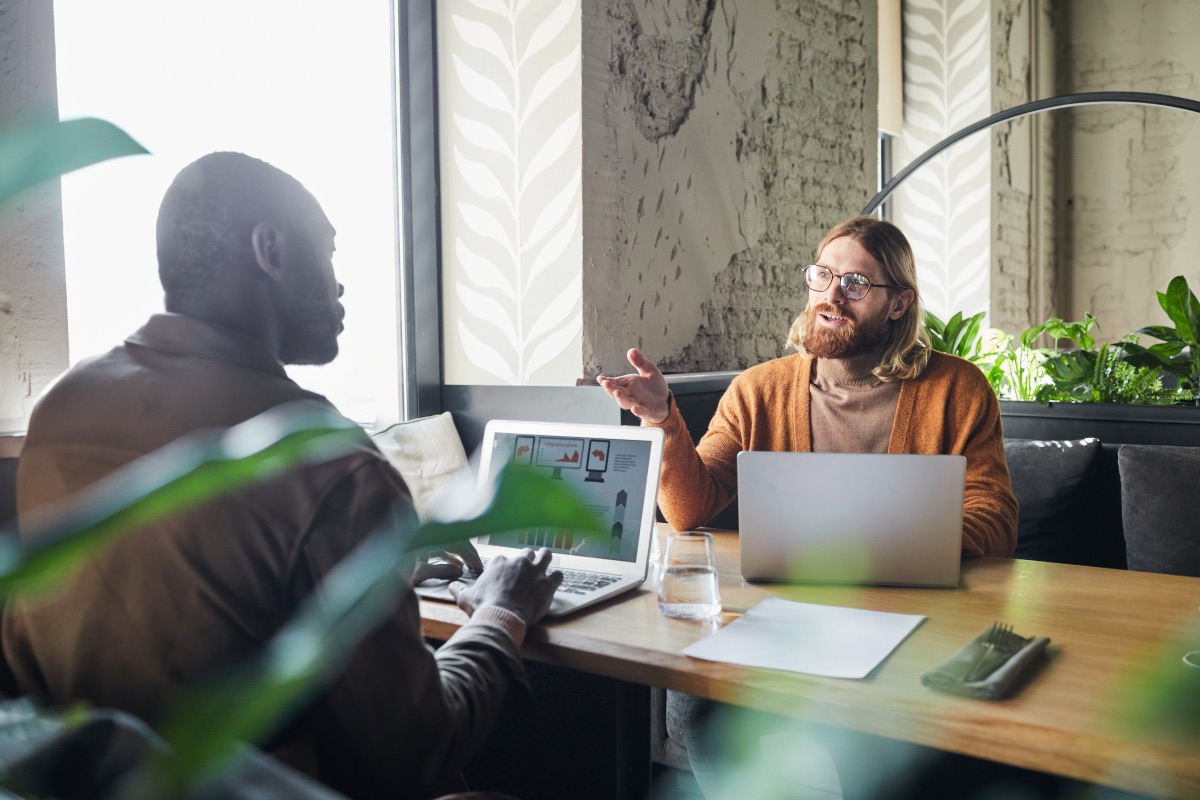 Filmmaker meeting with client to discuss video production brief and project approach