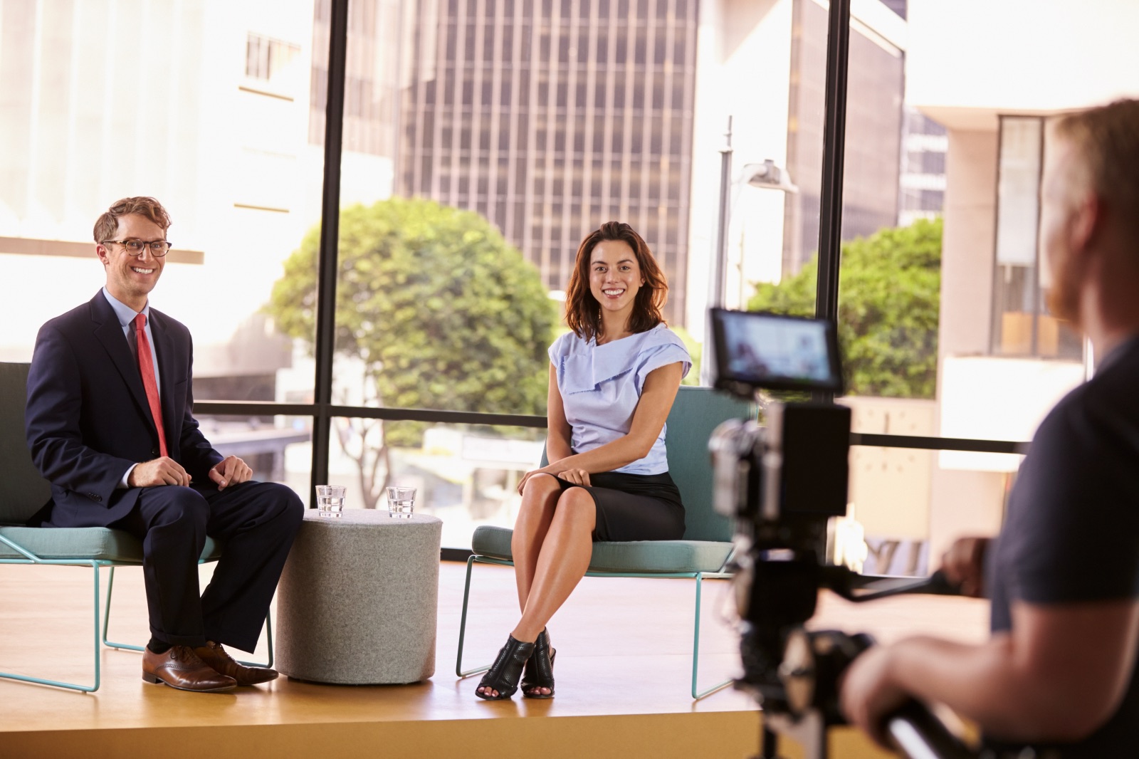 Corporate video interview being filmed in professional studio setting