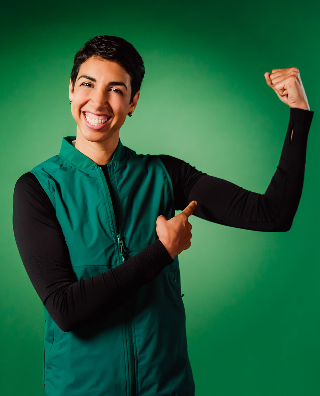 Portrait of Alexis Pritchard, retired Olympic and Commonwealth Games boxer, photographed for Mental Health Awareness Week campaign with green backdrop